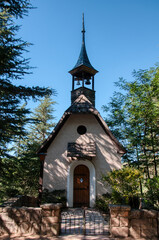 Naklejka premium Small church in the forest at the mountain town of La Cumbrecita, Cordoba, Argentina