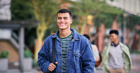 Knowledge, university and student on park walk for scholarship, education and future goals with portrait smile. Happy man, college or academy campus for learning, commute and pride with satisfaction