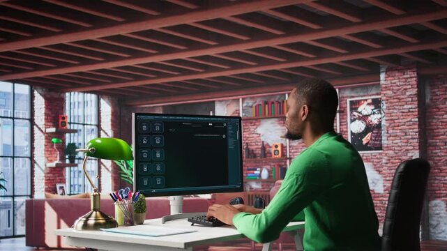 African american guy at home asks questions to AI chatbot virtual assistant, typing user prompts to generate information with the artificial intelligence tool. Machine learning. Camera B.