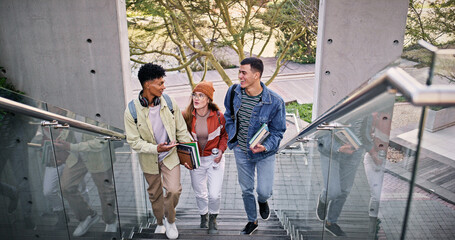 Development, education and walking with friends on stairs at college or university campus for...