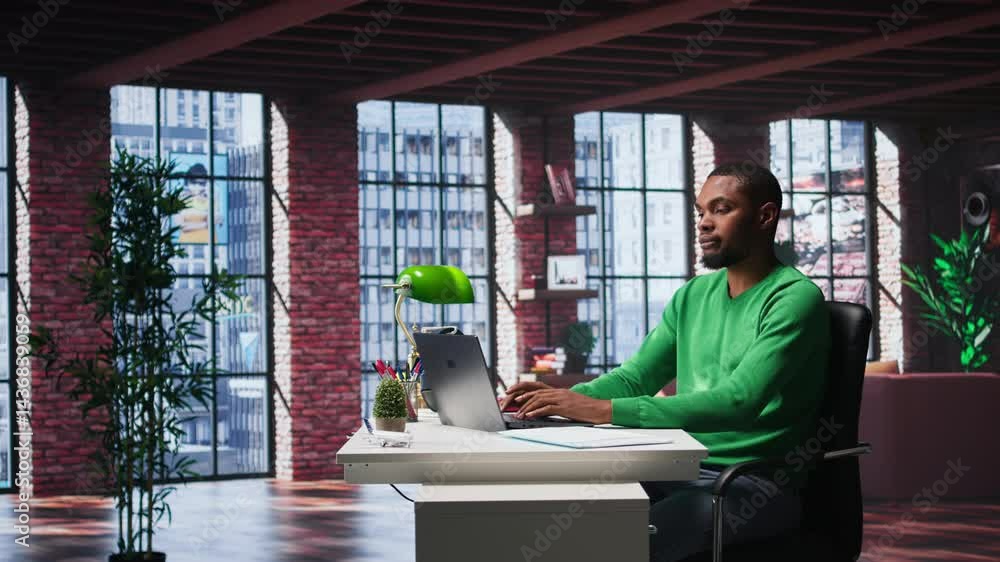Poster man at home desk using laptop and checking emails displayed on screen, reading messages in inbox and
