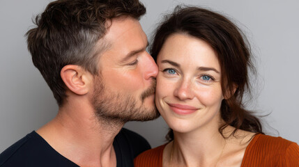 A vibrant closeup of a couple sharing a kiss, radiating love and deep emotional connection in a warm, intimate setting.