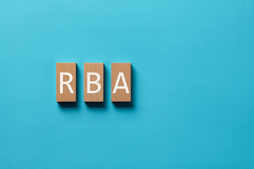 Obraz premium There is wood block with the word RBA. It is an abbreviation for Responsible Business Alliance as eye-catching image.
