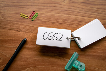 There is word card with the word CSS2. It is an abbreviation for Cascading Style Sheets Level 2 as eye-catching image.