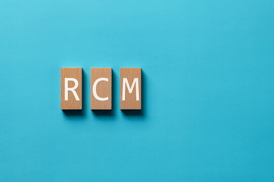 There is wood block with the word RCM. It is an abbreviation for Risk Control Matrix as eye-catching image.