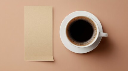 Overhead View of Coffee Cup and Blank Notecard on Beige Background