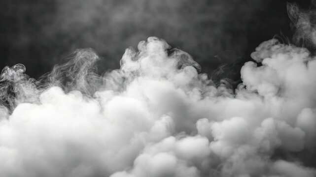 Rising plumes of white smoke against a dark backdrop creating an ethereal, abstract composition for special effects or atmospheric design work.