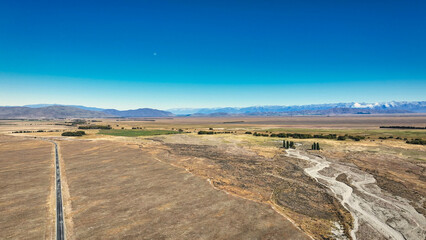 Remote rural arid desert like valley McKenzies Pass near Dog Kennel corner Tekapo