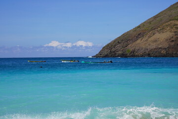 tropical Mawun Beach beach Lombok  with turquoise water and blue sky