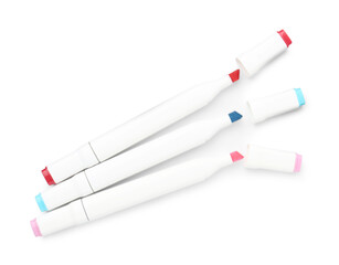 Double-sided marker pens on white background, top view