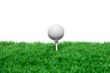 Golf ball, tee and green grass against white background