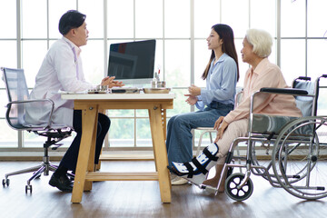 Elder woman and man have a consulting with doctor.