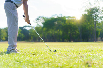 An Asian amateur golfer is enjoy playing golf in golf country club.