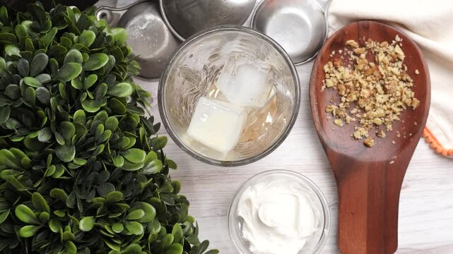 Making a dessert type of cocktail called the Carrot Cake Shot. Complete with nuts and cream cheese icing perfect for a sweet tooth. Cocktail, drinks and beverages for anytime of year.