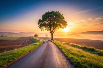 Fototapeta premium Minimalist Sunrise: Winding Country Road at Dawn