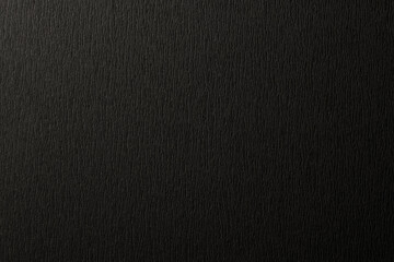ザラザラした質感のある黒い紙の背景テクスチャー