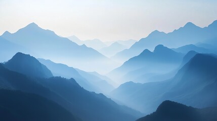 Naklejka premium Serene Blue Mountain Range Landscape at Dawn Misty Peaks Nature Scenery