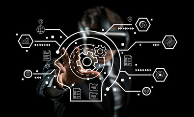 Businessman wearing virtual reality headset interacting with digital interface and technology concepts in futuristic environment