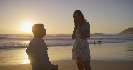 Surprise, sunset or couple at beach for proposal for romance, love or commitment offer. Engagement, holiday vacation or man on knee to ask shocked woman question on valentines day or anniversary date