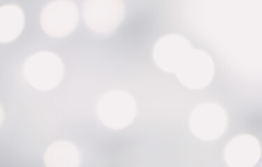 Abstract bokeh lights create a soft and blurred background with a bright glow. Bokeh background with bright and shiny light, sophisticated and modern design.
