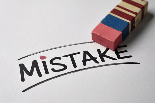 Mistake Correction with Eraser on White Paper