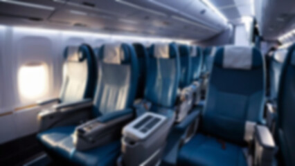 blurred airplane seats, interior inside a passenger plane, economy class, with blurred airplane seats background