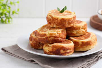 Kue Kamir. Kamir cake. served on a white plate. with copy space. originated from Pemalang, Middle Java, Indonesia.