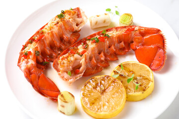 Delicious lobster tails with lemon, microgreens and green onion on white table, closeup
