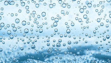 Soda water with bubbles as background, closeup