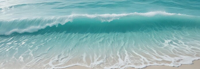 Obraz premium Crystal clear turquoise water, gentle waves create white foam patterns, caribbean, aqua