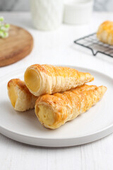 Kue cumcum. Horn pastry or cone pastry with vanilla cream.