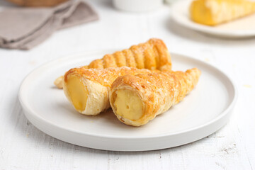 Kue cumcum. Horn pastry or cone pastry with vanilla cream.