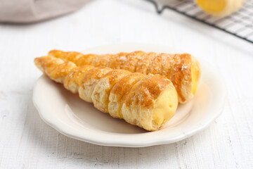 Kue cumcum. Horn pastry or cone pastry with vanilla cream.