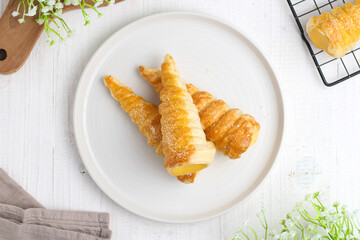 Kue cumcum. Horn pastry or cone pastry with vanilla cream.