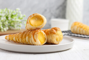 Kue cumcum. Horn pastry or cone pastry with vanilla cream.