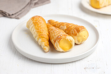 Kue cumcum. Horn pastry or cone pastry with vanilla cream.