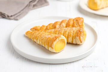 Kue cumcum. Horn pastry or cone pastry with vanilla cream.