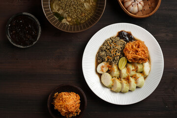 Lontong kupang, or rice cake with small white clams. traditional food of east java, indonesia.