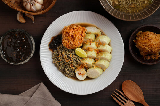Lontong kupang, or rice cake with small white clams. traditional food of east java, indonesia.