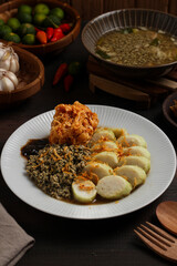 Lontong kupang, or rice cake with small white clams. traditional food of east java, indonesia.