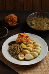 Lontong kupang, or rice cake with small white clams. traditional food of east java, indonesia.