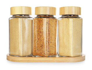 Many different aromatic spices in jars isolated on white