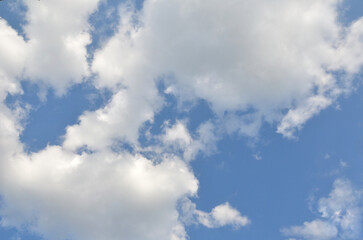 White fluffy clouds on bright blue sky background. Blue sky , landscape, nature, environment.