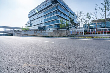 Obraz premium modern business office buildings with empty road,empty concrete square floor 