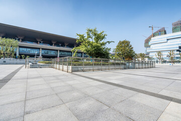 Obraz premium modern business office buildings with empty road,empty concrete square floor 