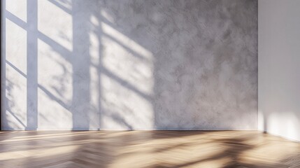 Obraz premium Sunlit empty room with hardwood floor and textured wall.