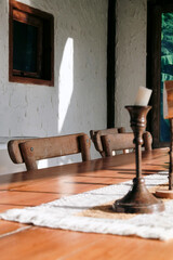 detail of Wooden table and chair in the interior of a country house.