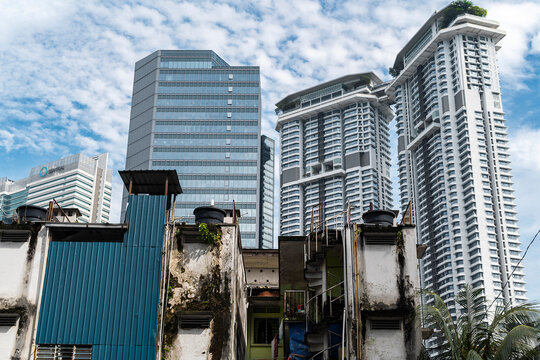 Modern skyline behind weathered rooftops