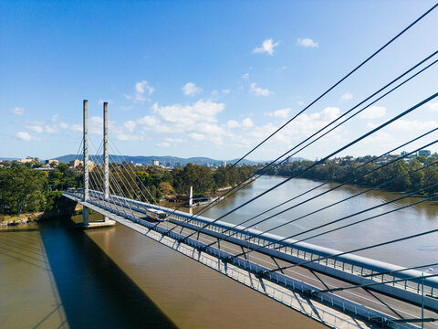 Aerial view looking across the Eleanor Schonell Bridge as a bus passes over