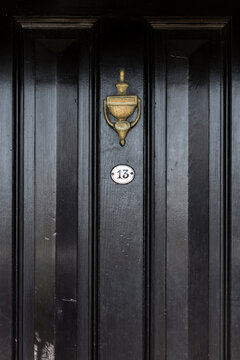 black door with number 13